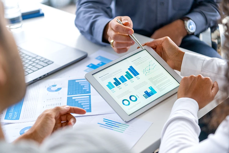 Medical practice owners analyze business data during a meeting