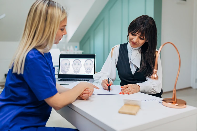 Medical spa nurse reviews beauty procedure details with a new client