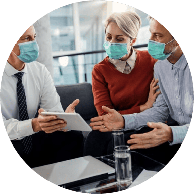 A modern medical broker consulting a couple for concierge treatment in San Antonio, TX