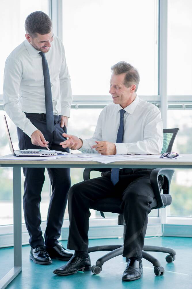 A medical broker consulting a man for healthcare-related services in San Antonio, TX